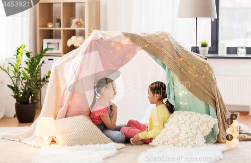 Image of little girls talking in kids tent at home