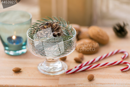 Image of christmas fir decoration with cone in dessert bowl