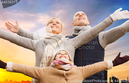 Image of happy family over sunset in tallinn city in autumn