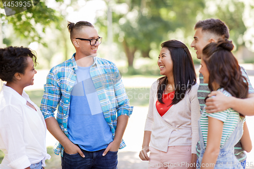 Image of group of happy international friends in park