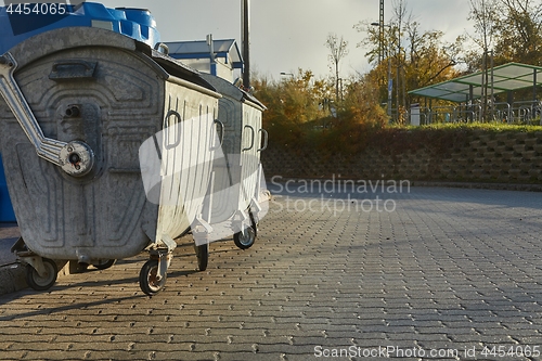 Image of Garbage Containers in a urban area