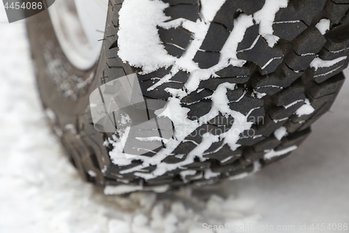 Image of Car tyre in snow