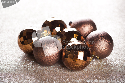 Image of Christmas golden and brown decorations.