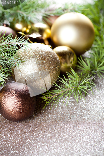 Image of Christmas decorations and evergreen fir tree branch.