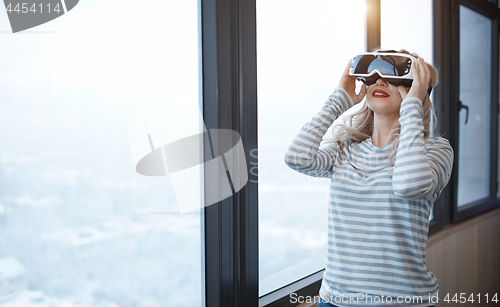 Image of Woman wearing Virtual reality headset