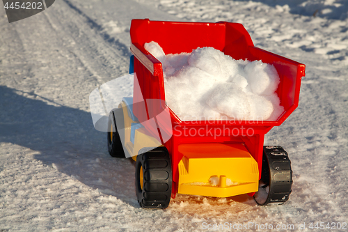 Image of toy stuck with snow on road