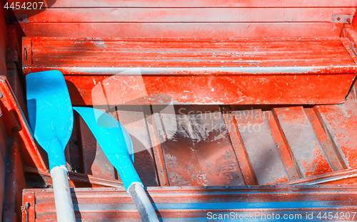 Image of Oars In An Old Red Boat Close-up