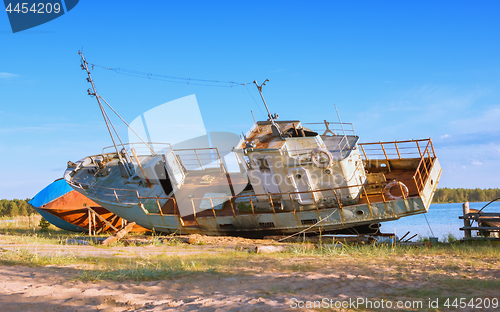 Image of Old Abandoned Fishing Ships On The Riverbank