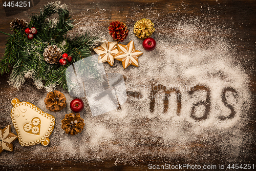 Image of Christmas background with branch and gingerbread