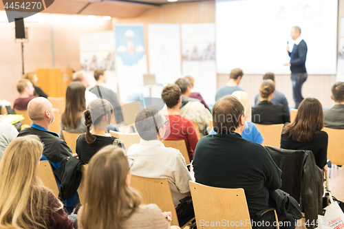 Image of Business speaker giving a talk at business conference event.