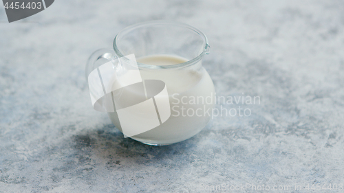 Image of Small cream pitcher with milk