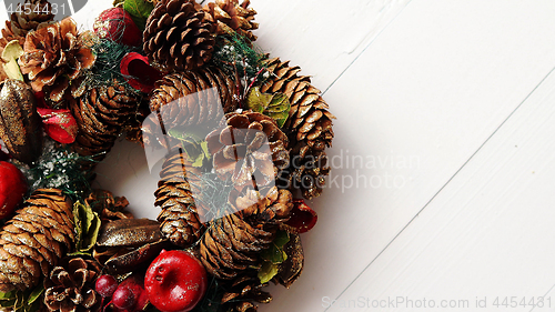Image of Christmas Wreath on White Wooden Background