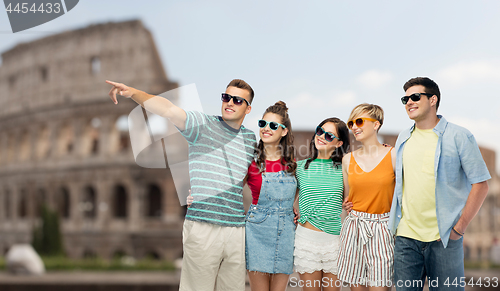 Image of friends in sunglasses over coliseum background