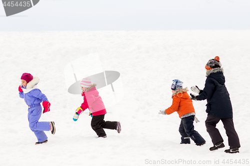 Image of happy little kids playing outdoors in winter