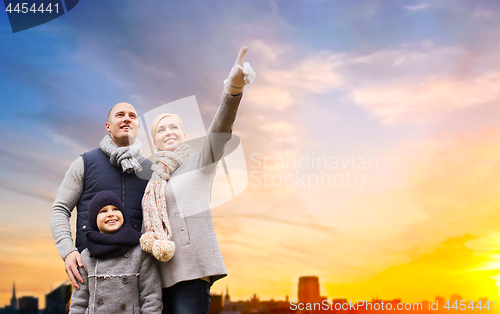 Image of happy family over sunset in evening tallinn city