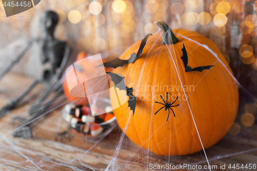 Image of halloween pumpkins, skeleton and candies
