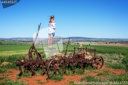 Image of Farmlands views for miles from rusting farm tiller