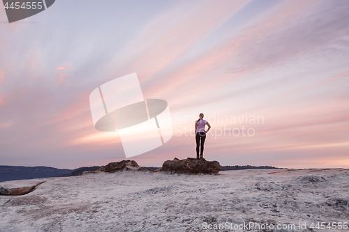 Image of Girl stands awestruck dmiring the Blue Mountains Sunset