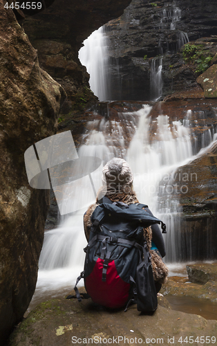 Image of Bushwalker in awe of the waterfalls