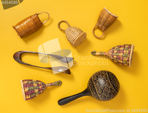 Image of Wooden percussion instruments on yellow background