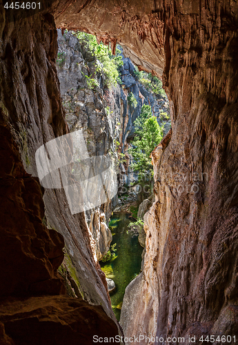 Image of Views through the tinted cave to the narrow canyon
