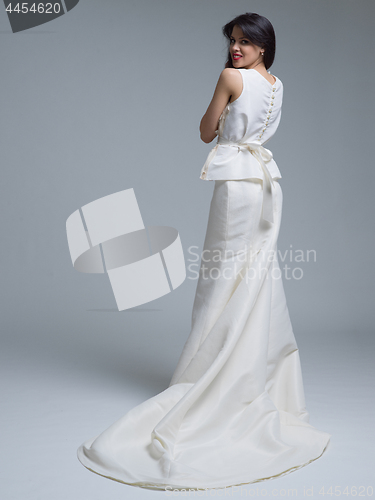 Image of Rear view of a beautiful young woman in a wedding dress