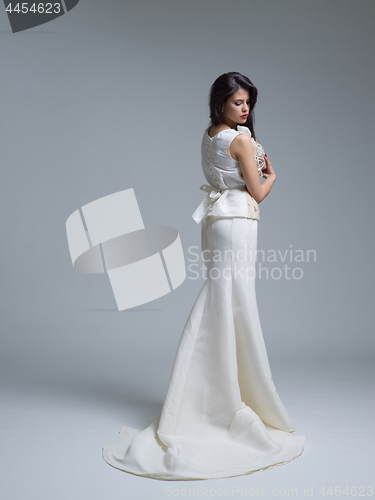 Image of Rear view of a beautiful young woman in a wedding dress