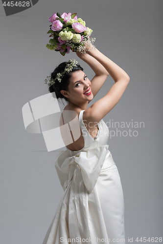 Image of bride with a bouquet  isolated on white background