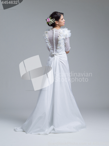 Image of Rear view of a beautiful young woman in a wedding dress