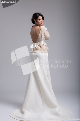 Image of Rear view of a beautiful young woman in a wedding dress