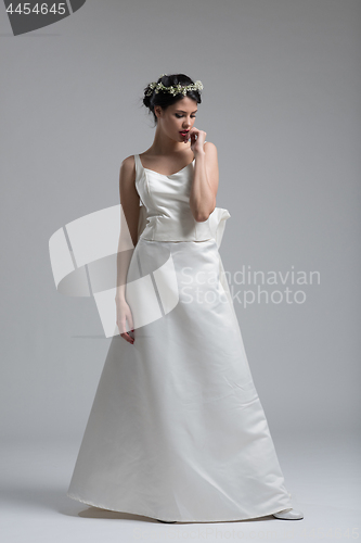 Image of Portrait of beautiful young women in wedding dress