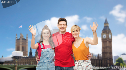 Image of friends over houses of parliament in london