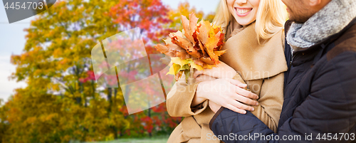 Image of close up of couple hugging in autumn park