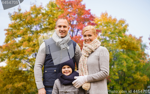 Image of happy family over autumn park background