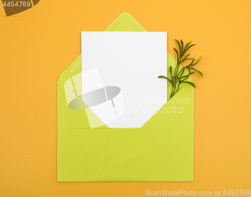 Image of Envelope with blank card on bright yellow background