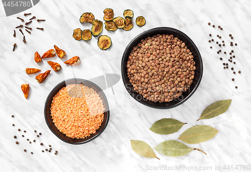 Image of Lentils and cooking ingredients on marble background