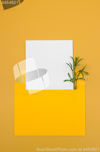 Image of Bright yellow envelope with blank white card