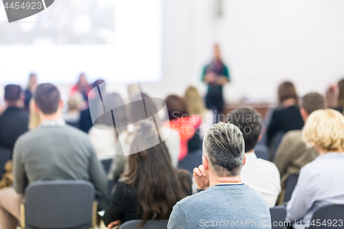 Image of Woman giving presentation on business conference workshop.