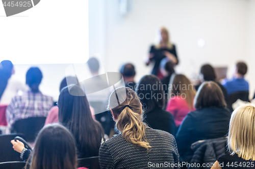 Image of Woman giving presentation on business conference workshop.