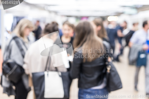 Image of Blured image of businesspeople networking and socializing during coffee break at business event.