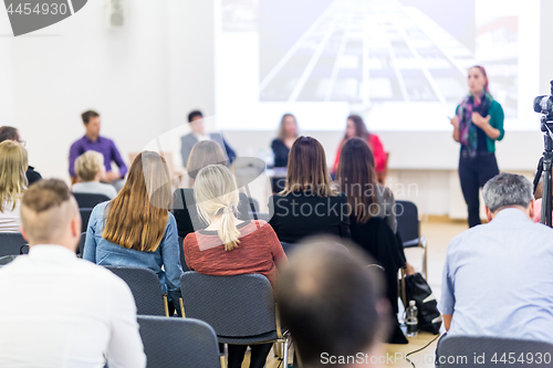 Image of Woman giving presentation on business conference workshop.