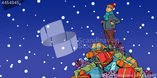 Image of Christmas sale Shopping gifts. skier middle-aged man, On a mount