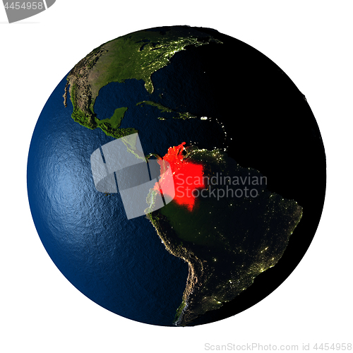 Image of Colombia in red on Earth isolated on white