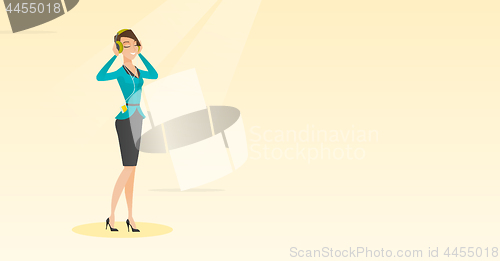 Image of Young woman in headphones listening to music.