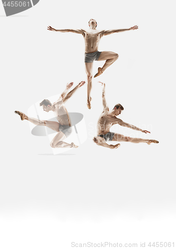 Image of The male athletic ballet dancer performing dance isolated on white background.