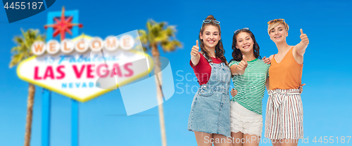 Image of happy teenage girls showing thumbs up at las vegas