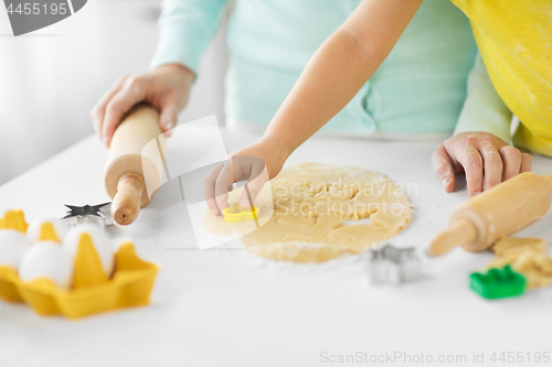 Image of mother and daughter making cookies at home