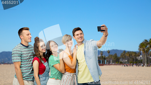 Image of friends taking selfie over venice beach