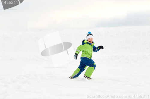 Image of happy boy having fun outdoors in winter