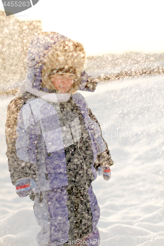 Image of Boy enjoying the first snow